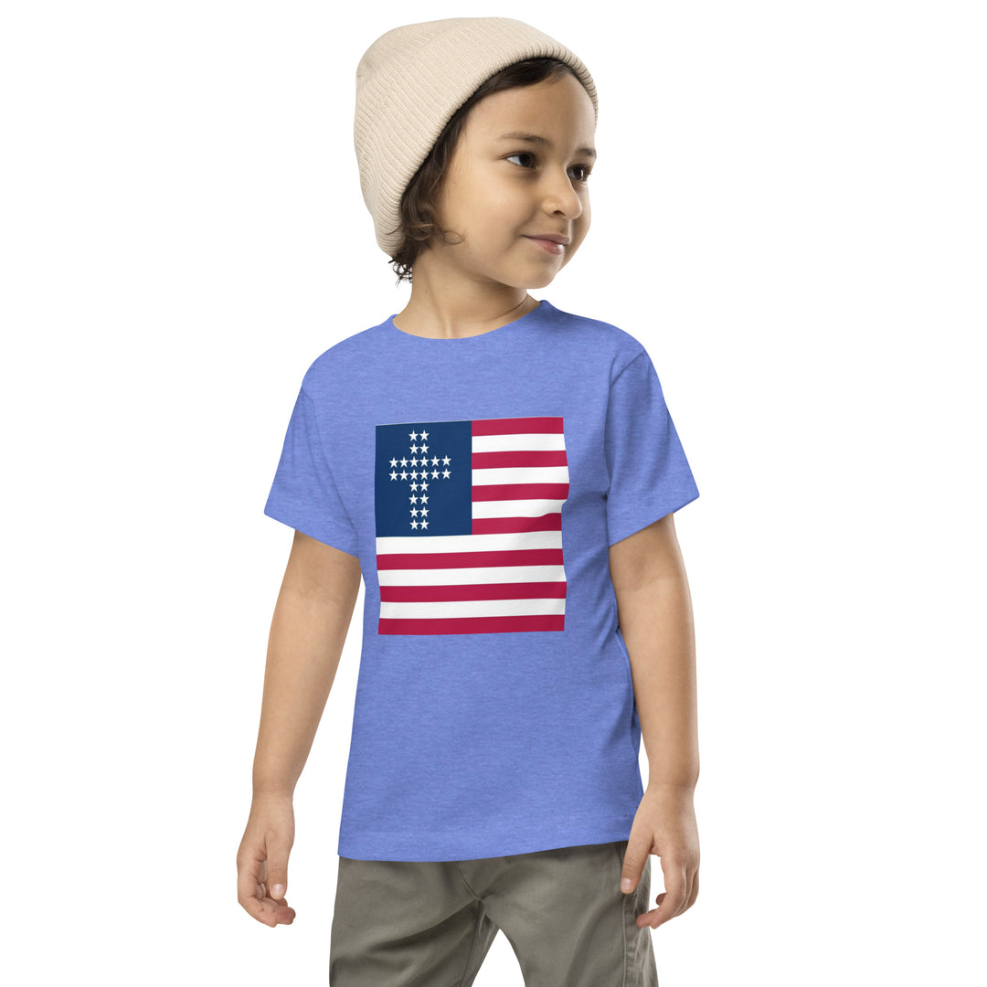 Camiseta infantil com cruz e listras