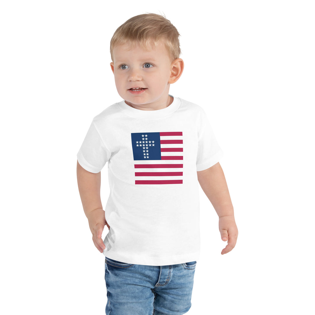 Camiseta infantil com cruz e listras