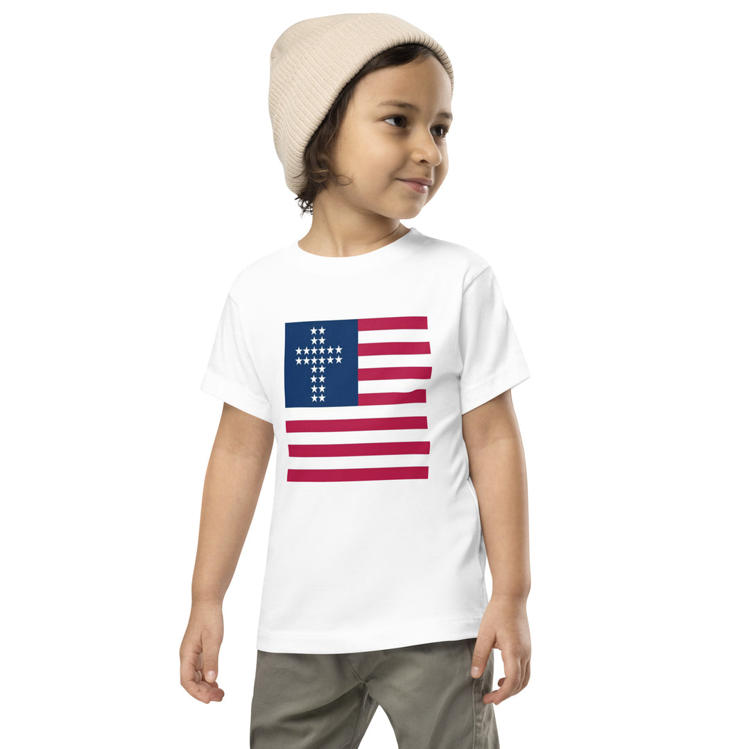 Camiseta infantil com cruz e listras